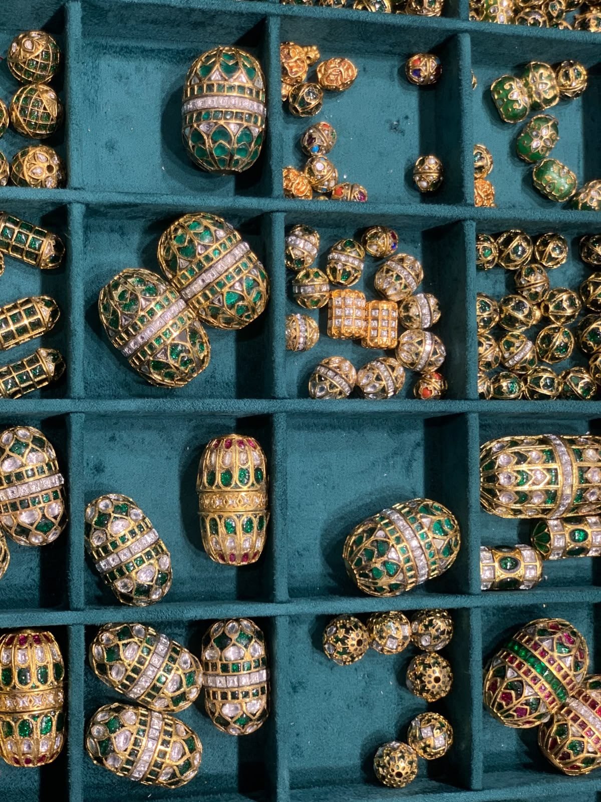 Tray of hand-hammered gold beads