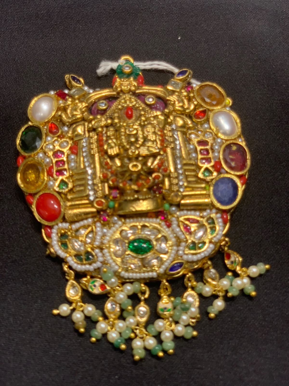 Temple-style gold pendant locket